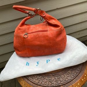 Hype Orange leather hobo bag.